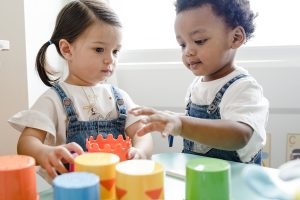 Little kids playing toys at learning center